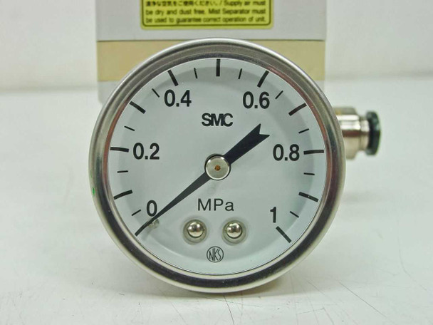 SMC 0–1 MPa pressure gauge close-up showing scale face and needle, NKS marked