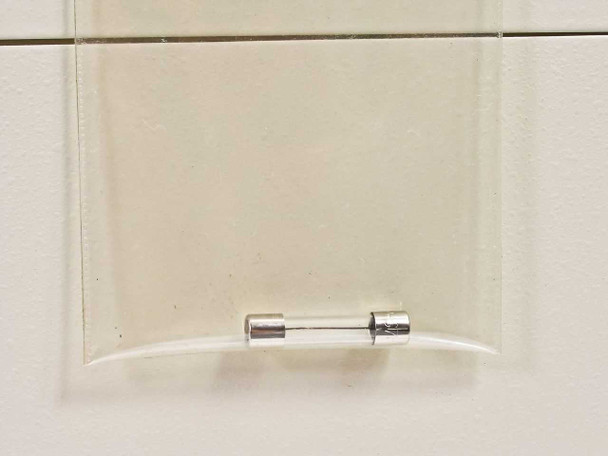 Tomy Seiko MTX-150 rear panel spare fuse – glass cartridge fuse stored in clear plastic fuse holder mounted on rear housing