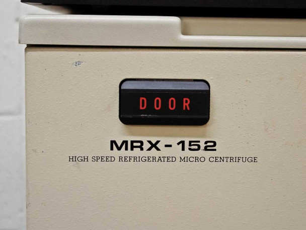 Tomy MRX-152 front panel nameplate – DOOR indicator illuminated, HIGH SPEED REFRIGERATED MICRO CENTRIFUGE label visible