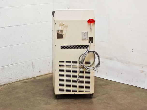 Tomy Seiko MRX-151 Refrigerated Centrifuge — rear view showing ventilation grille, power cable, and rotor key mounted on side panel