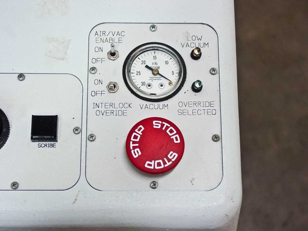 Villa Precision GS-210 operator panel detail showing Air/Vacuum Enable switch, vacuum gauge, Interlock Override toggle, Low Vacuum indicator, and red STOP emergency button