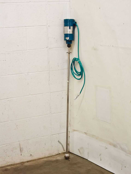 MTS Level Plus A910410172 analog level temperature transmitter full view — blue housing, 41-inch stainless steel rod, round buoy float, teal flying lead cable coiled against wall