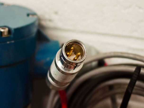 MTS A910410172 multi-pin circular locking connector on signal cable — gold pins visible