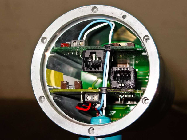 MTS A910410172 transmitter head opened showing internal circuit board, terminal blocks, and wiring