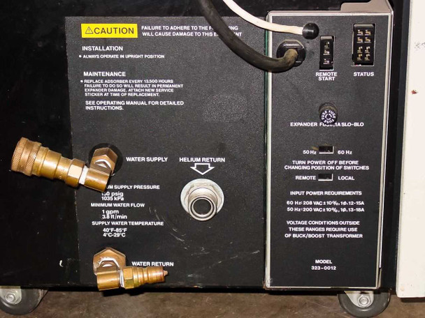 Varian 323-0012 rear panel close-up — water supply and helium return fittings, installation and maintenance caution label, Remote/Local switch, Remote Start, Status indicators, and power requirements placard