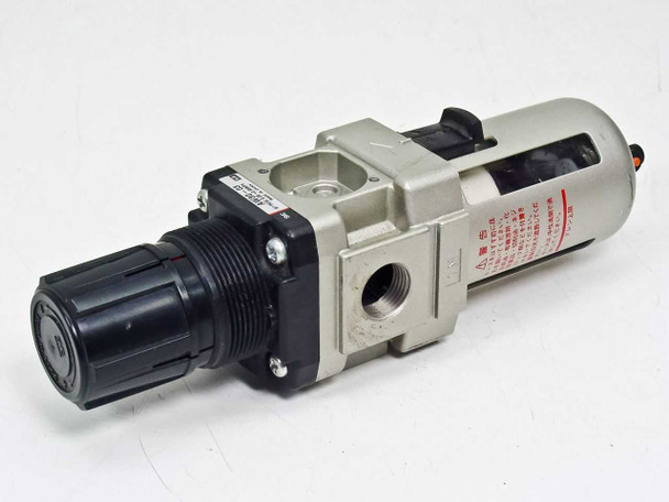 SMC AW30-03KR filter regulator – left-side three-quarter view showing regulator adjustment knob and port body