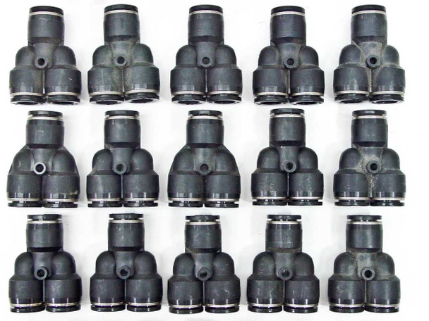 Grid of approximately 15 black SMC Y-style push-to-connect fittings showing uniform lot