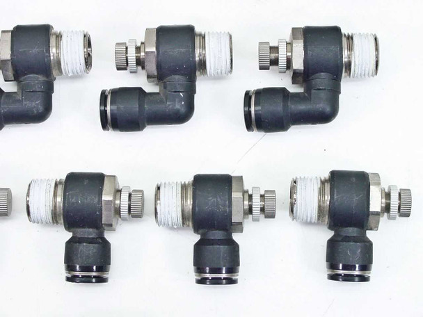 SMC black elbow speed controller fittings — six units close-up showing knurled adjusters, threaded male ends, and push-in tube connections