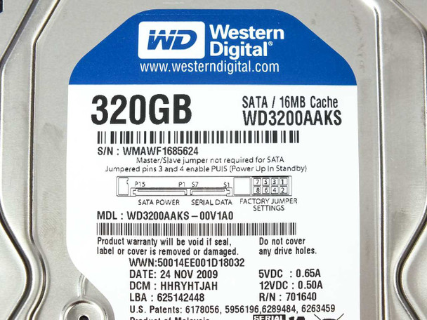 Western Digital WD3200AAKS hard drive label close-up showing full model number, serial number, date, and power specs