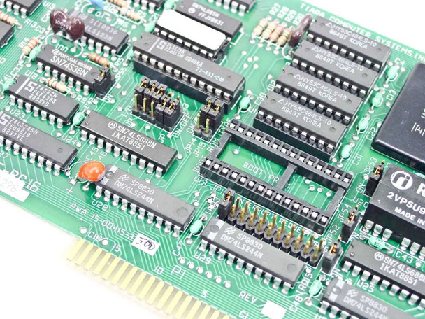 Tiara Lancard/E-PC 16 — close-up of PCB center showing DIP ICs, jumper headers, and 'REV' silk-screen designation