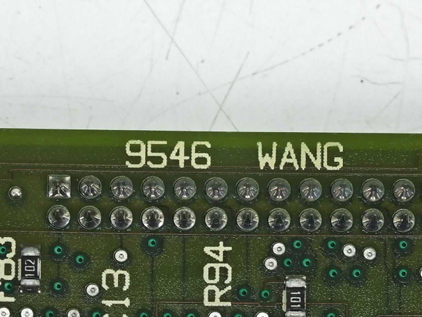 Wang 9546 PCB silkscreen closeup showing '9546 WANG' printed on board with solder joints and surface-mount components