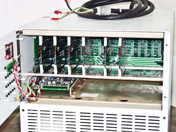 Dynatronix PMC 351/6-10-20XR — interior view with side panel open showing full card cage with approximately eight green PCBs and lower controller board tray