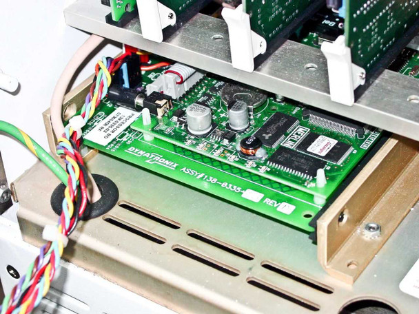 Dynatronix PMC 351/6-10-20XR — interior close-up of Dynatronix controller board ASSY 990-9333 Rev B installed in lower tray with ICs and capacitors visible