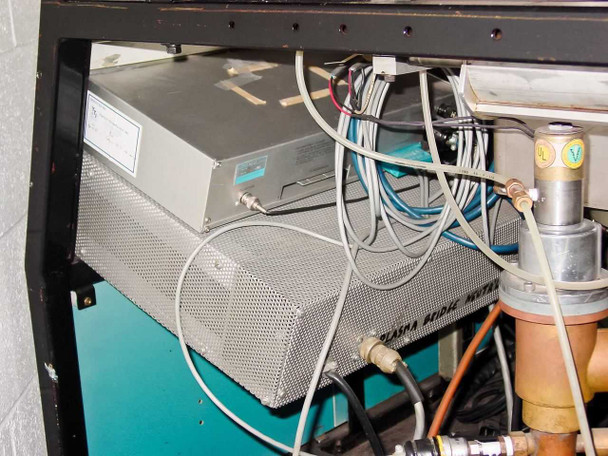 Interior under-cart view showing Plasma Bridge Neutralizer power supply module (perforated aluminum enclosure) with coax and signal cables