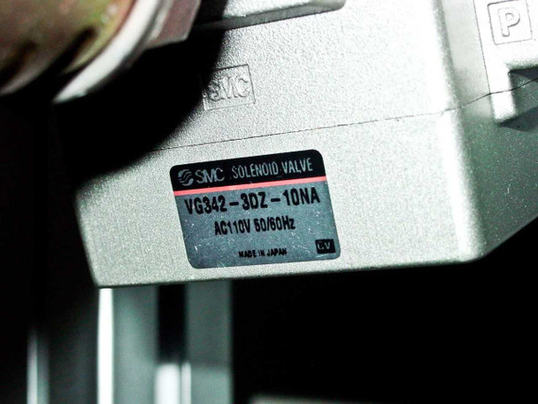 Close-up of SMC VG342-3DZ-10NA solenoid valve label showing AC110V 50/60Hz and Made in Japan markings