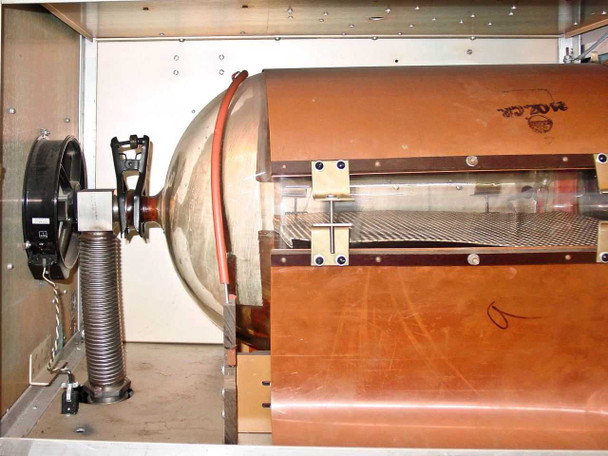 LFE PDS-501 plasma etch system — side view of barrel reactor chamber showing stainless steel end bell with bellows vacuum fitting and copper RF shielding enclosure