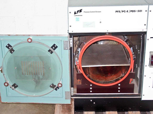 LFE PFS/PCrE/PDS-501 — front panel and chamber door both open; LFE Process Control Division nameplate and model designation PFS/PCrE/PDS-501 visible on top fascia; barrel reactor chamber open showing red O-ring seal and perforated tray