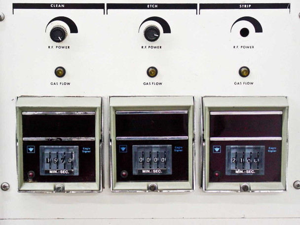 LFE PDS-501 control panel — lower section showing three process zones (Clean, Etch, Strip) each with RF Power rotary control, Gas Flow indicator lamp, and Eagle Signal electromechanical Min:Sec timer displays