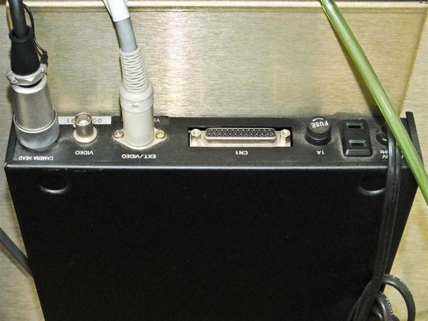 Camera controller module rear panel showing Camera Head port, Video, Ext/Video BNC connectors, CN1 DB25 connector, 1A fuse, and IEC power switch
