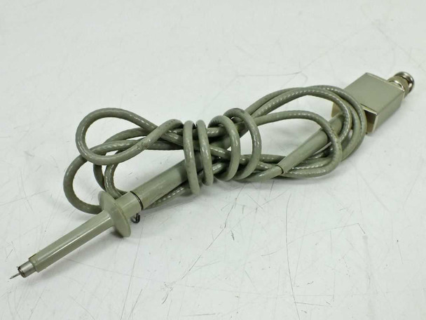 HP 10013A 10:1 oscilloscope probe – full length view showing coiled cable and probe tip