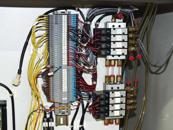 BF-200 interior pneumatic and electrical panel detail – numbered terminal strip, solenoid valve manifold bank with brass fittings, and bundled multi-color wiring