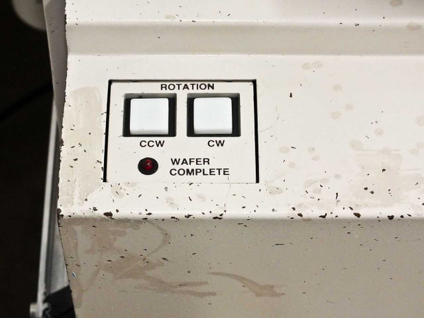 P5NMS front panel control section showing Rotation CCW and CW buttons and Wafer Complete indicator light with surface soiling
