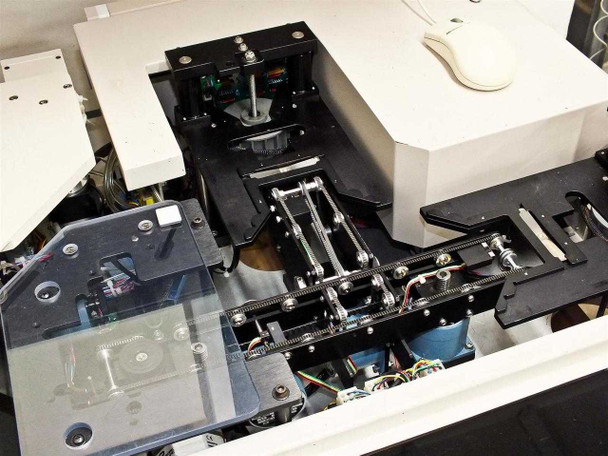 Top-down view of P5NMS wafer transport mechanism showing linear rails, belt drives, stepper motors, and robotic arm components