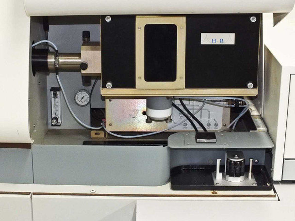 Interior view of IRIS Advantage spectrometer showing optical bench, flow meter, pressure gauge and sample introduction components