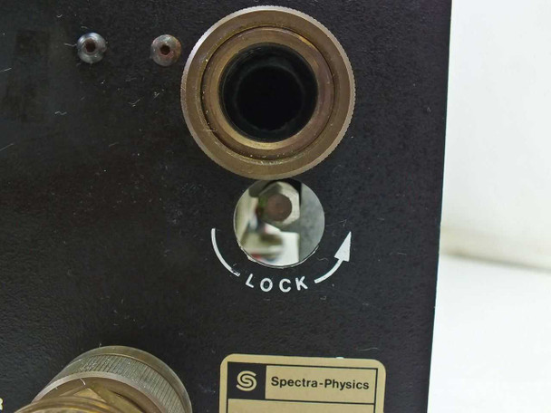 Spectra-Physics 2210 — closeup of lock mechanism knob and upper water fitting on black face plate