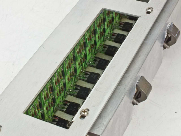 Spectra-Physics 2210 — internal view through chassis opening showing rows of power transistors on green PCB