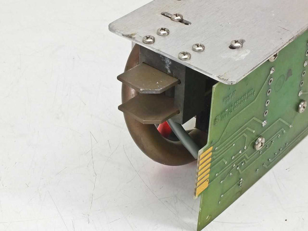 Spectra-Physics 2210 laser power supply — end view showing toroidal transformer and wiring harness on PCB
