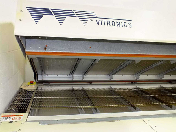 Vitronics ISO5006 reflow oven — front interior view with hood raised, showing Vitronics logo, heating zones, and conveyor belt