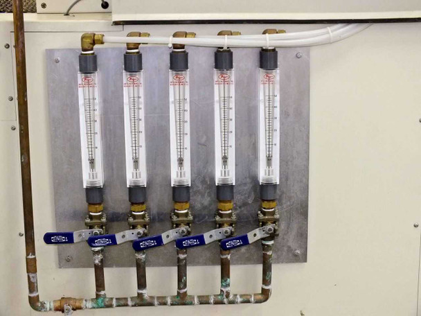 Vitronics ISO5006 nitrogen flow meter bank — five individual Dwyer-style flow meters with blue shutoff valves on stainless mounting panel