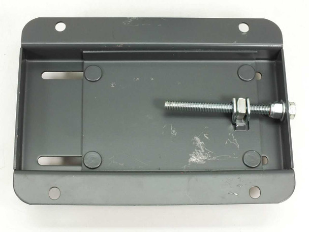 Motor mounting base — underside view showing adjustment bolt, nut, and slide slots