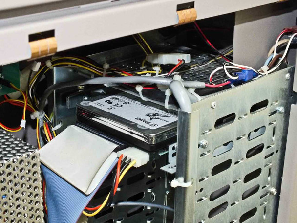 Interior drive bay – Seagate hard drive installed in metal drive cage with SATA/IDE cabling and power connectors