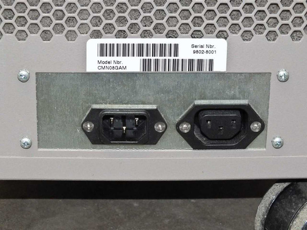 Rear power entry panel – two IEC C13/C14 power inlet connectors on rear panel plate with model and serial number barcode label (CMN08GAM, SN 9802-6001)