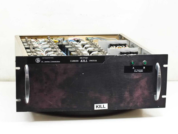 GE SM-TT&C Carrier Kill Switch front panel view showing black rackmount chassis with 'CARRIER KILL SWITCH' label, GE American Communications branding, KILL pushbutton, and dual green LED indicators for A and B redundant 24V power supplies