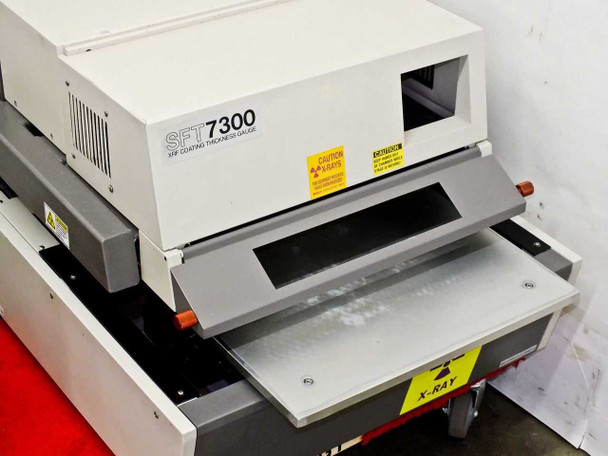 Seiko SFT7300 XRF gauge head — side view with sample tray extended, X-RAY caution label visible