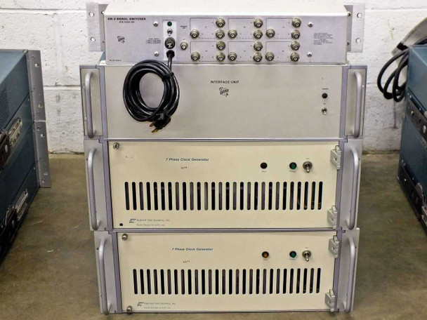 Rack stack showing SM-5 Signal Switcher (top, p/n 015-0281-00), Station Control Interface Unit (middle), and two 7 Phase Clock Generator units (bottom) — Tektronix branding visible