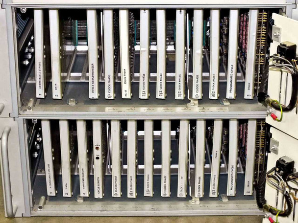 Interior of 7 Phase Clock Generator unit with cover open — card cage showing labeled plug-in modules including Clock Phase, Programmable Cycle, Delay, Data, and other function cards in both upper and lower chassis