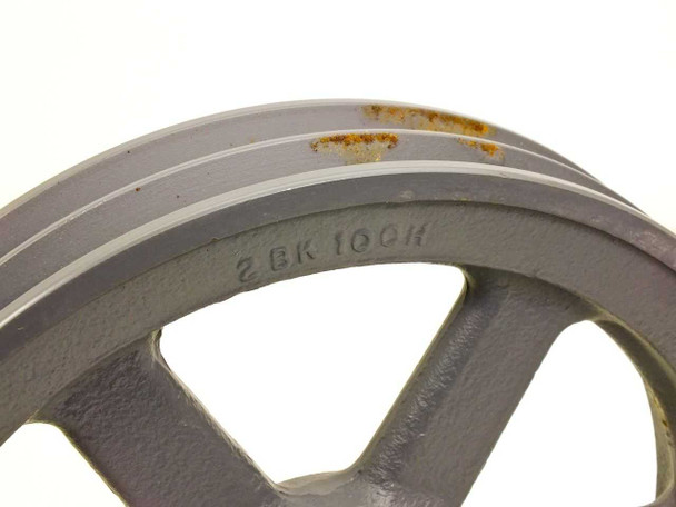 Browning 2BK100H sheave close-up of belt grooves and cast model number markings, showing light surface rust on groove faces