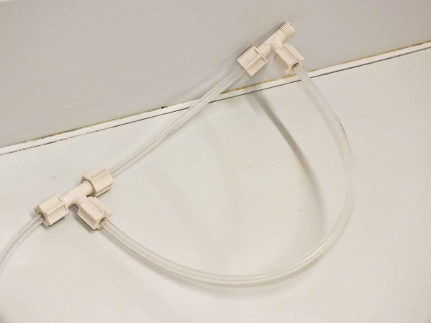 White pneumatic tubing assembly with tee fittings and connectors laid flat – included hardware detail