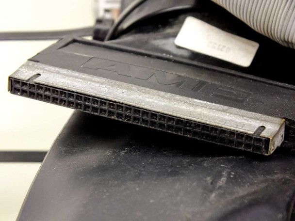 AMI or similar labeled flat ribbon cable connector on the III514B emulation harness, showing dust and age wear