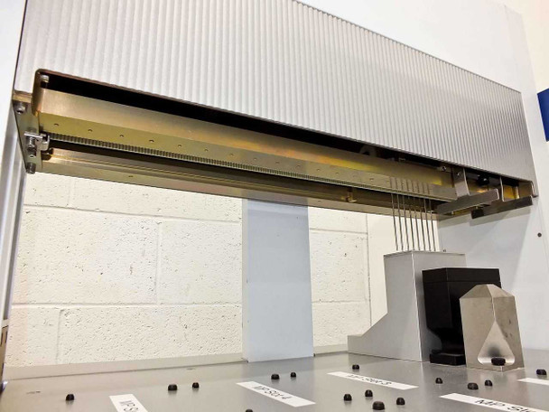 Side view of BioRobot 8000 X-axis gantry rail with liquid handling probes and needles suspended, tool station visible at right