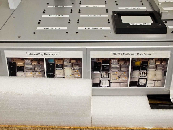 BioRobot 8000 front foam area with two laminated deck layout reference cards: Plasmid Prep Deck Layout and Ni-NTA Purification Deck Layout