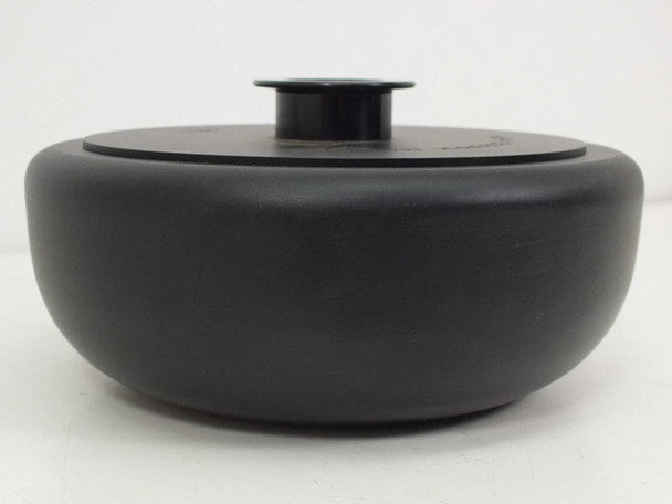 Tomy TMS-4 centrifuge rotor side profile view with lid seated, showing compact low-profile form factor