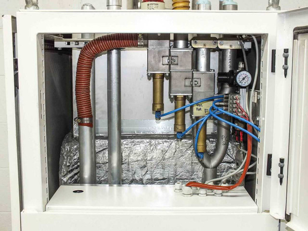 Lanco LTX08 upper interior compartment open — foil-insulated heat exchanger, brass pneumatic valves and fittings, blue pneumatic tubing, and pressure gauge