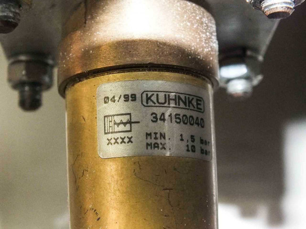 Kuhnke pneumatic component closeup — label reads 04/99 KUHNKE 34150040, MIN 1.5 bar MAX 10 bar