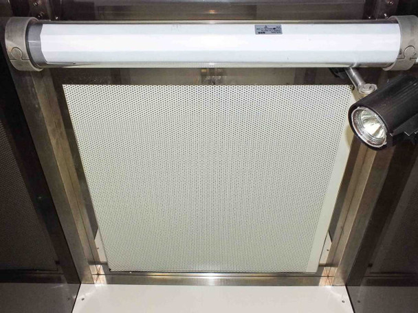 Underside of flow hood showing HEPA filter panel (Air Tech SS-MAC MAC-101) with fluorescent tube lamp and spot lamp