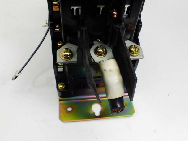 Hitachi H80 contactor bottom view showing coil wiring, ceramic coil former, and zinc-plated mounting base plate